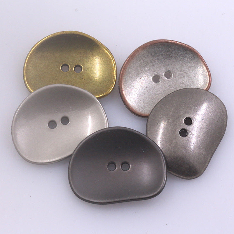 Set of irregular two-hole metal buttons in gold, rose-gold, silver, and dark gray