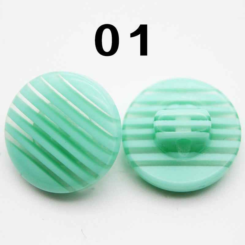 Color 01: mint-green striped resin shirt button, round shank, front and back.