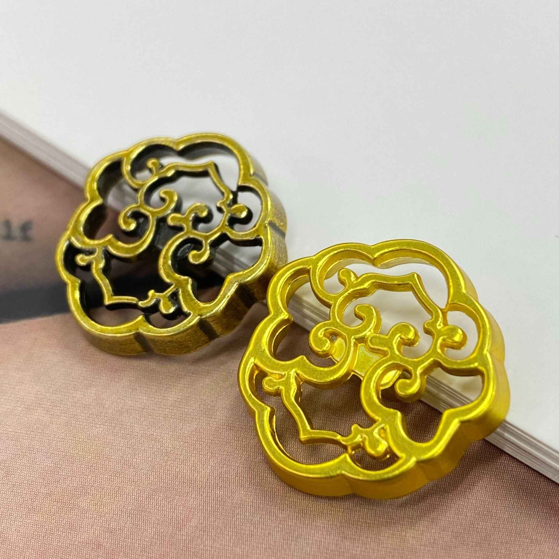 Pair of gold filigree cloud buttons with shank for clothing