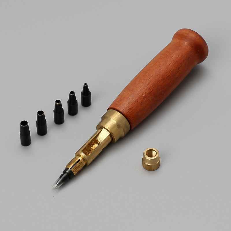 Brown wood-handled leather belt hole punch tool with brass collar and tip