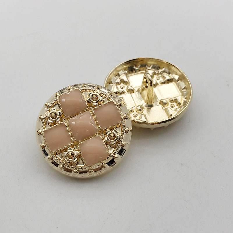 Gold 22mm round rhinestone shank button, beige grid with decorative scroll detail