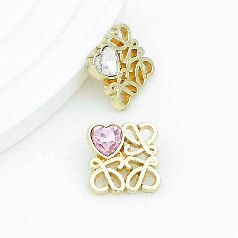 Gold square filigree button with clear heart glass and loop shank