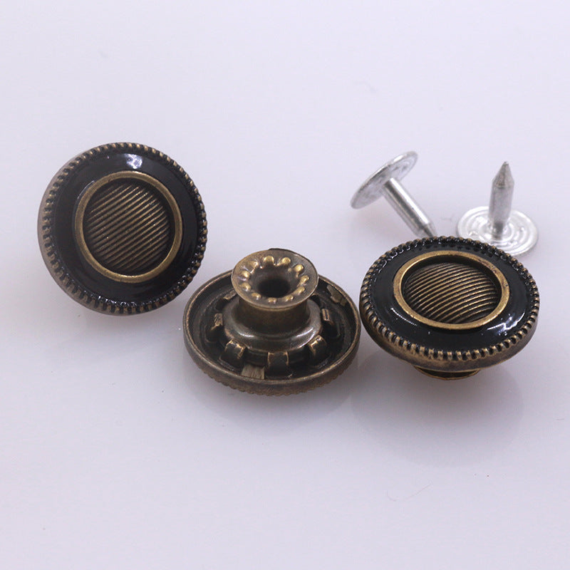 Antique bronze stud buttons with black rim and silver posts, mixed front and back, 4 shown