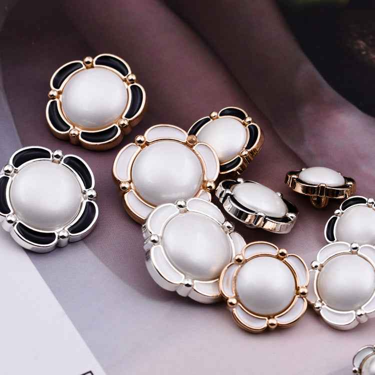 Assorted round shank buttons, floral lace design, white enamel with black/metal tones