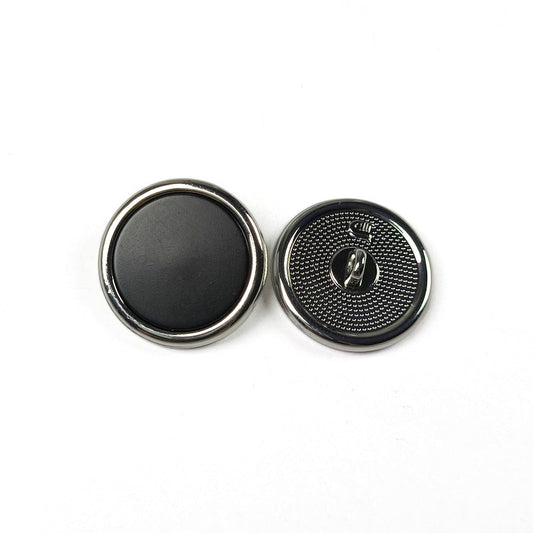 Round metal shank button set, black face with silver rim and engraved shank