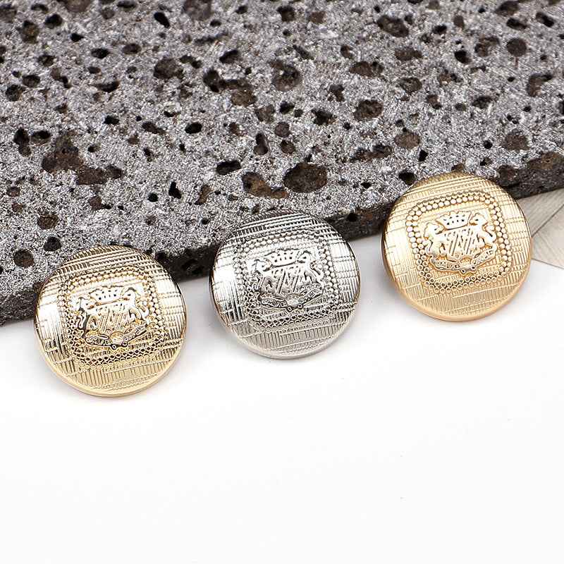Round metal shank buttons with speckled texture; gold and silver finishes, front views