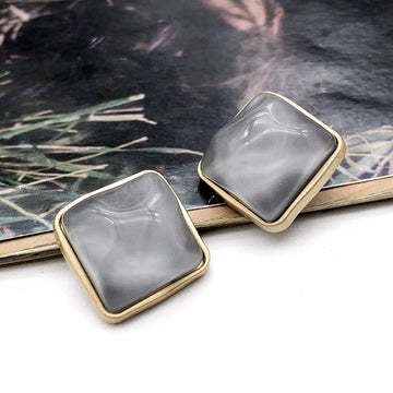 Square stone-look coat buttons, dark grey, gold-tone metal shank, pair view
