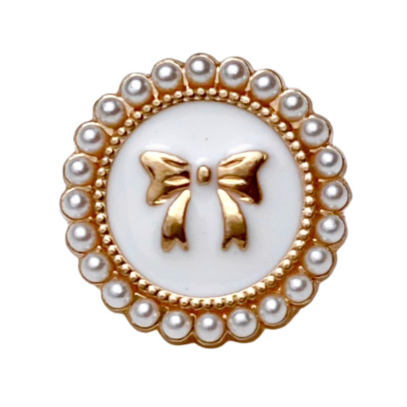 White bowknot pearl metal button with gold bow center and round pearl border