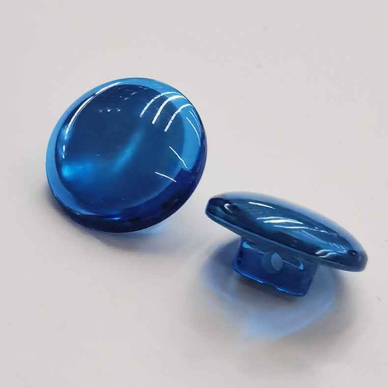 Blue domed resin shank button with visible shank on back