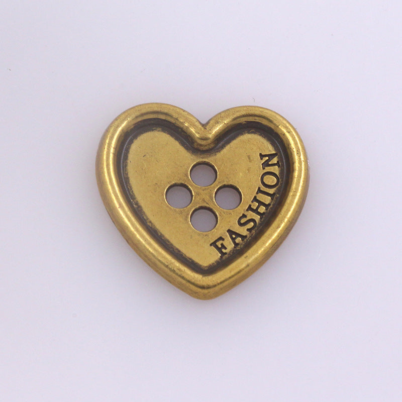 Heart-shaped metal button with four holes, gold finish for clothing