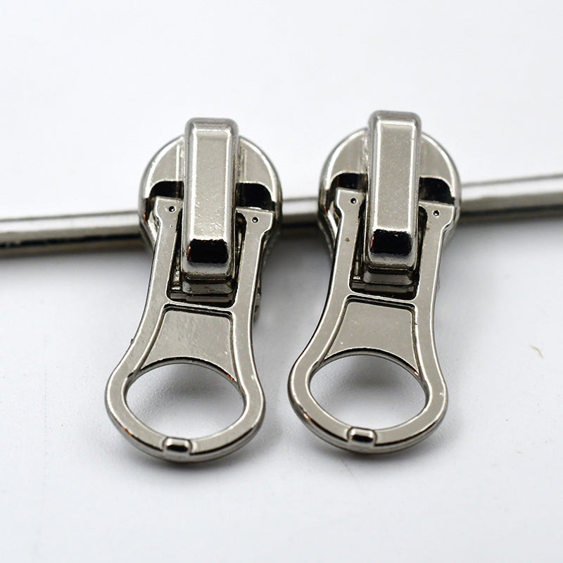 Two heavy-duty metal zipper pulls (#4) in silver finish, round ring grip tab