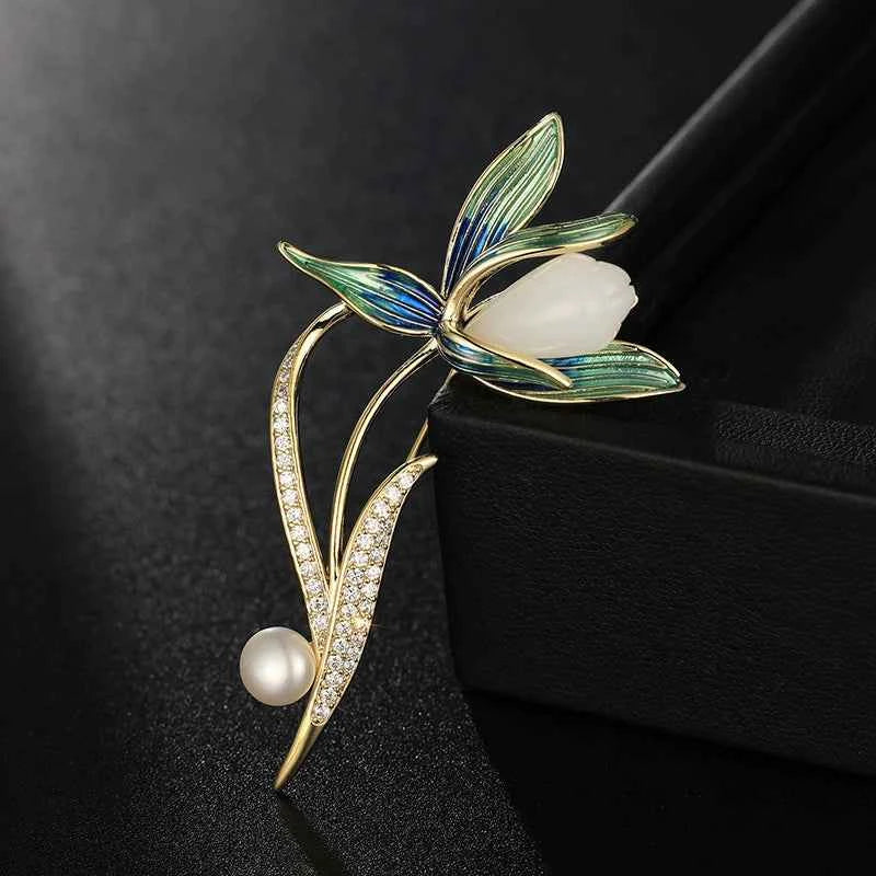 Magnolia enamel brooch pin with oval white stone, blue-green leaves, pearl teardrop