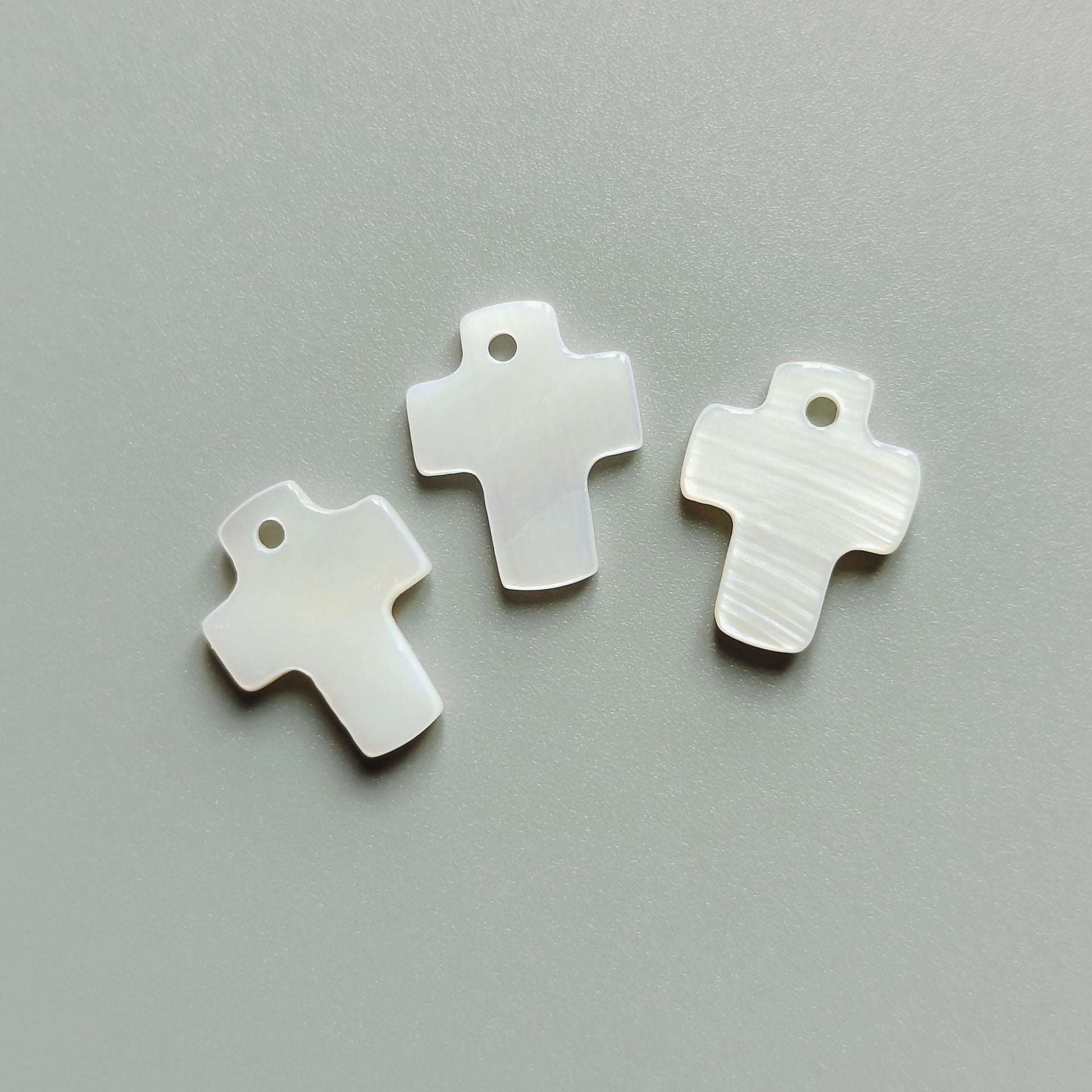 White cross shell buttons, single-hole design, 12.5mm, 3 shown