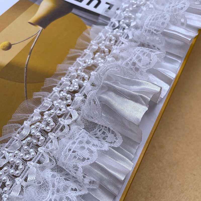 White satin-and-lace ruffle trim with gathered mesh panels and pearl bead clusters