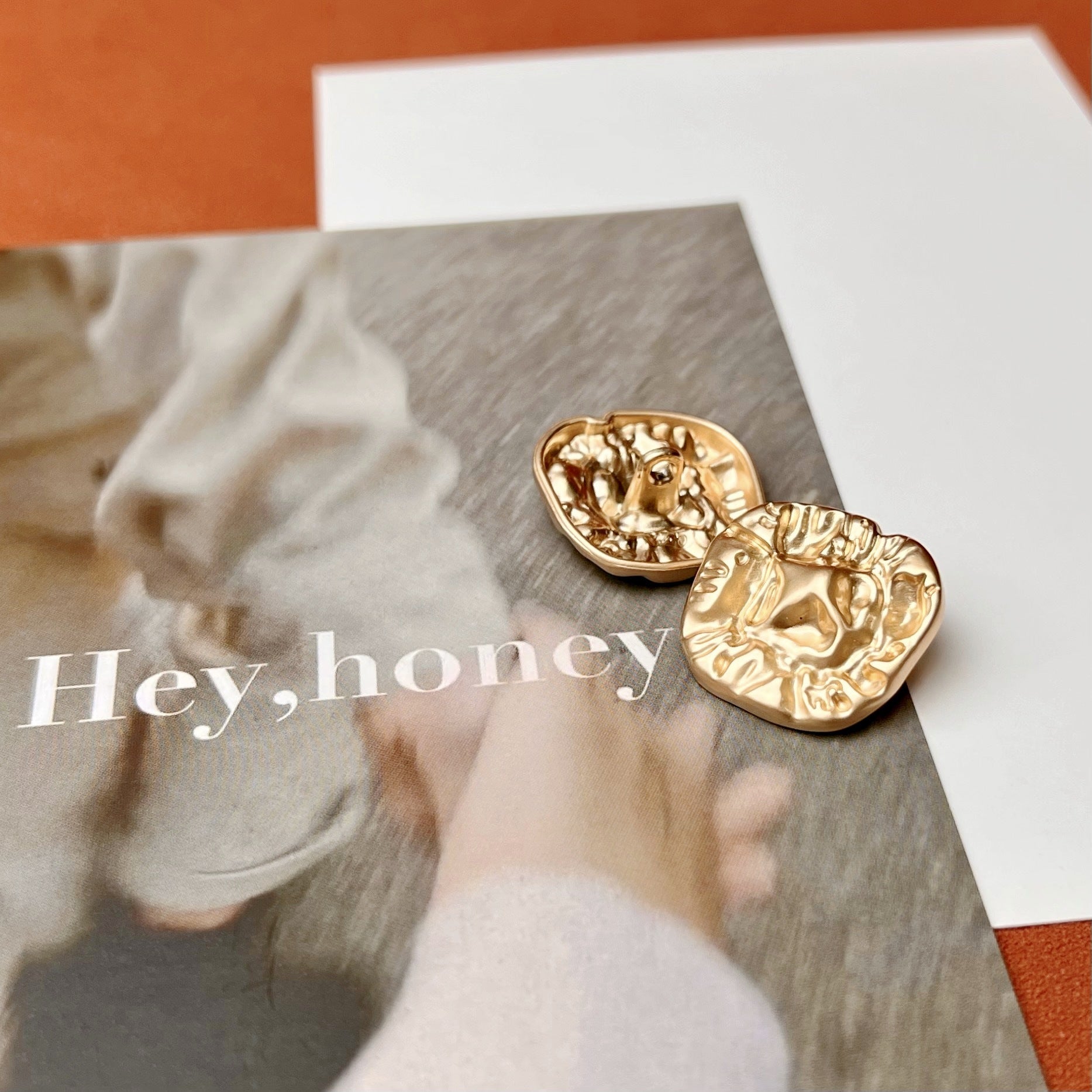 Gold alloy irregular buttons with raised relief texture, 2-pack close-up