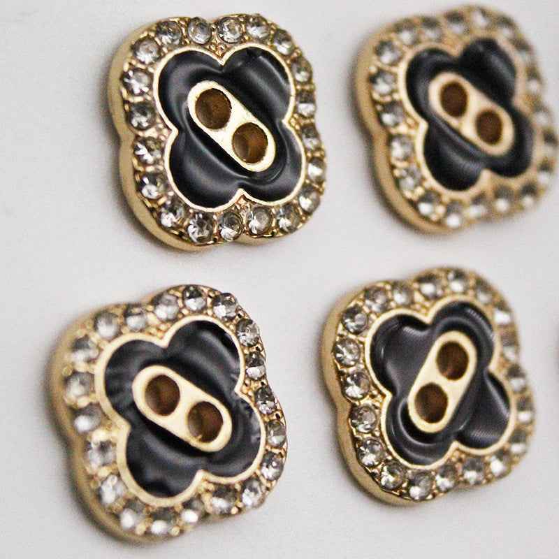 Clover square 2-hole shirt button, black satin center with gold-tone rhinestone border
