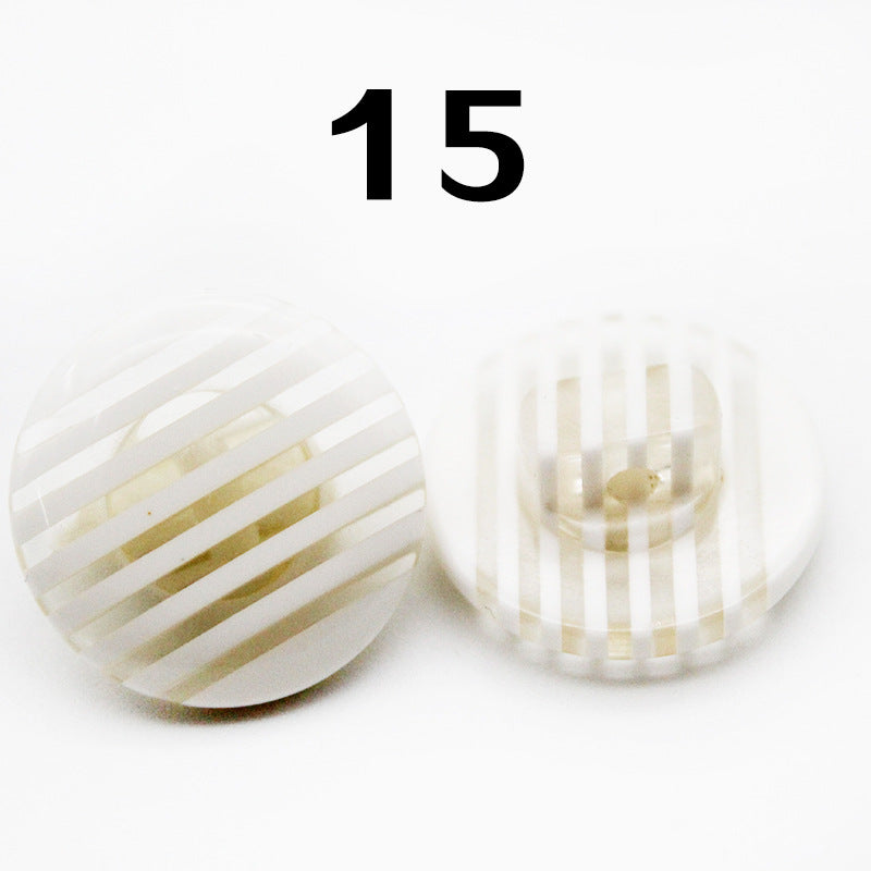 Rainbow striped resin shirt button, round, white with pale gold stripes; Color 15