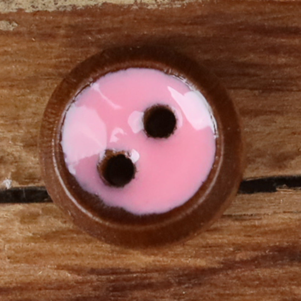 Round 2-hole wood shirt button with pink front and natural brown rim