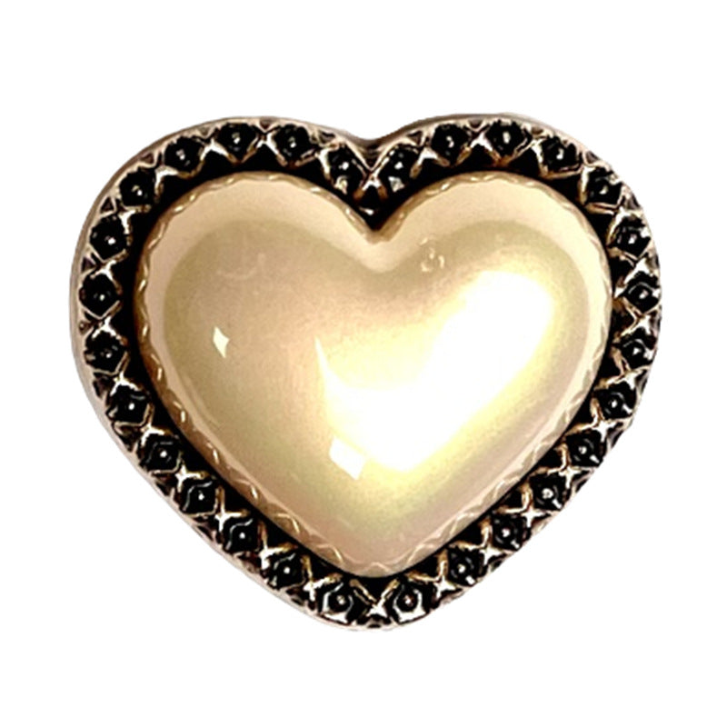 Heart shank button: golden-pearl sheen, bronze edge, black studded border