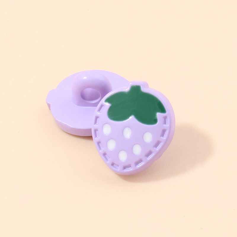 Lavender strawberry-shaped plastic shank button with green leaf and white dotted holes