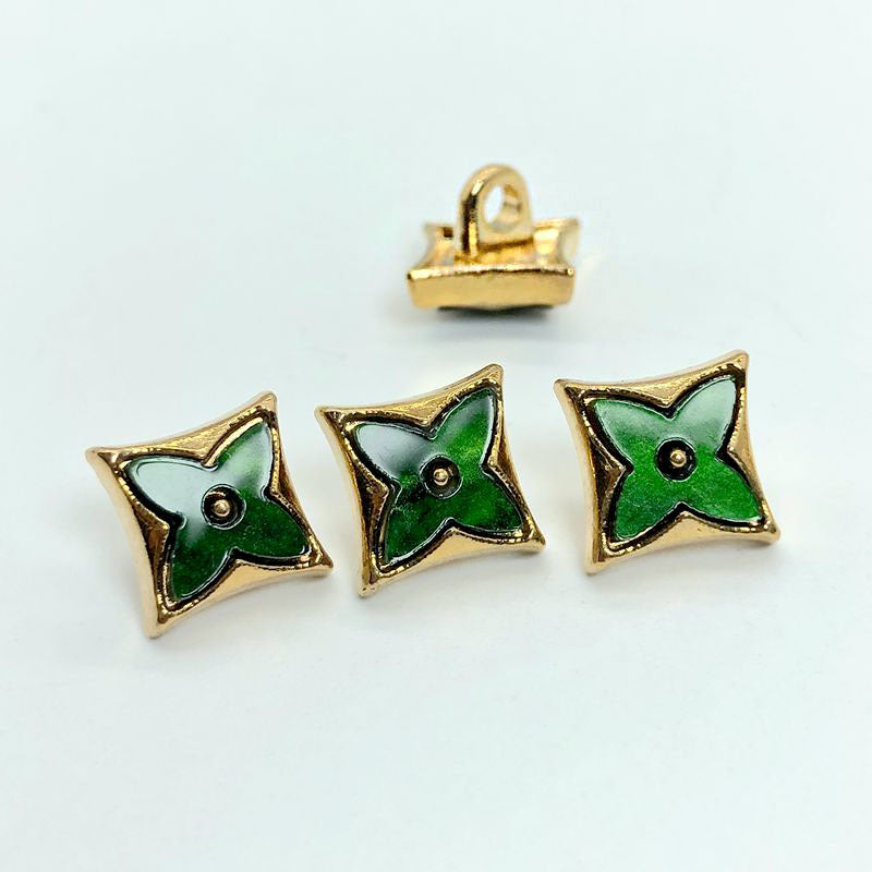 Green enamel rhombus four-leaf clover shirt buttons with gold rim and metal shank (two front, one back)