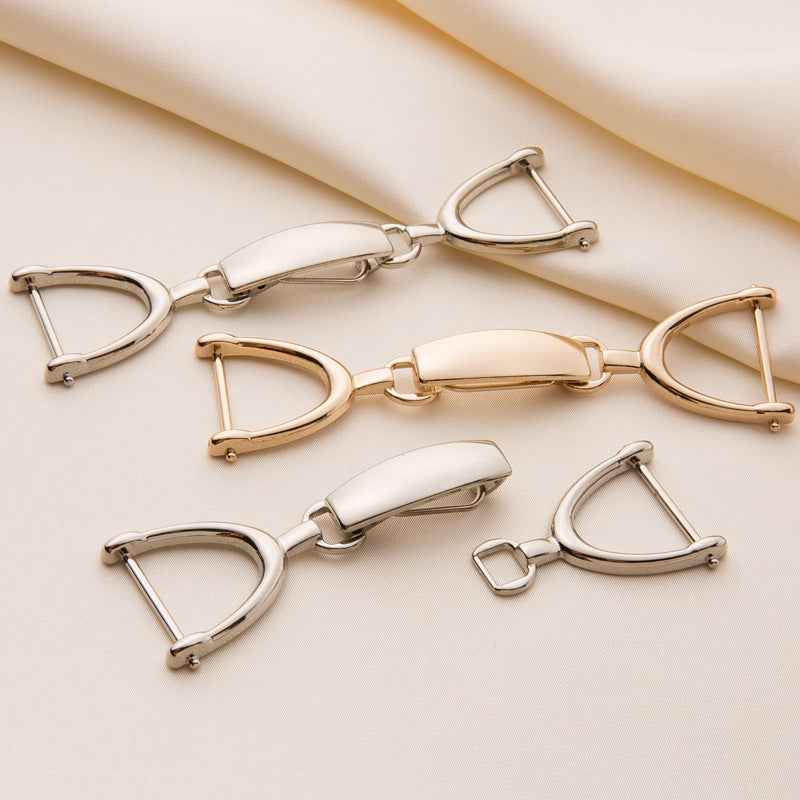 Gold and silver coat hook buckles with rectangular snap bar and D-ring hooks