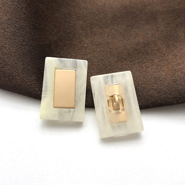 Beige rectangular resin buttons with metal shank, 22mm; two pieces shown