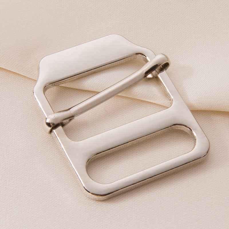 Adjustable ladder lock buckle with silver-tone metal frame and pull bar