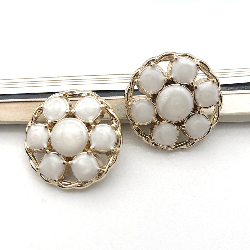 Style 6 round gold metal shank button, cluster of white circular insets in filigree