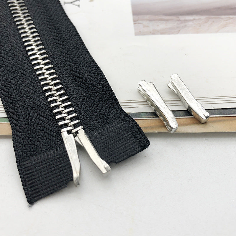 #5 zipper slider retainer pins on black zipper tape, metal replacement parts