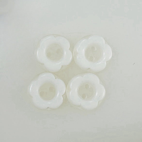 Pair of 12mm cartoon resin buttons in off-white, 2-hole front view
