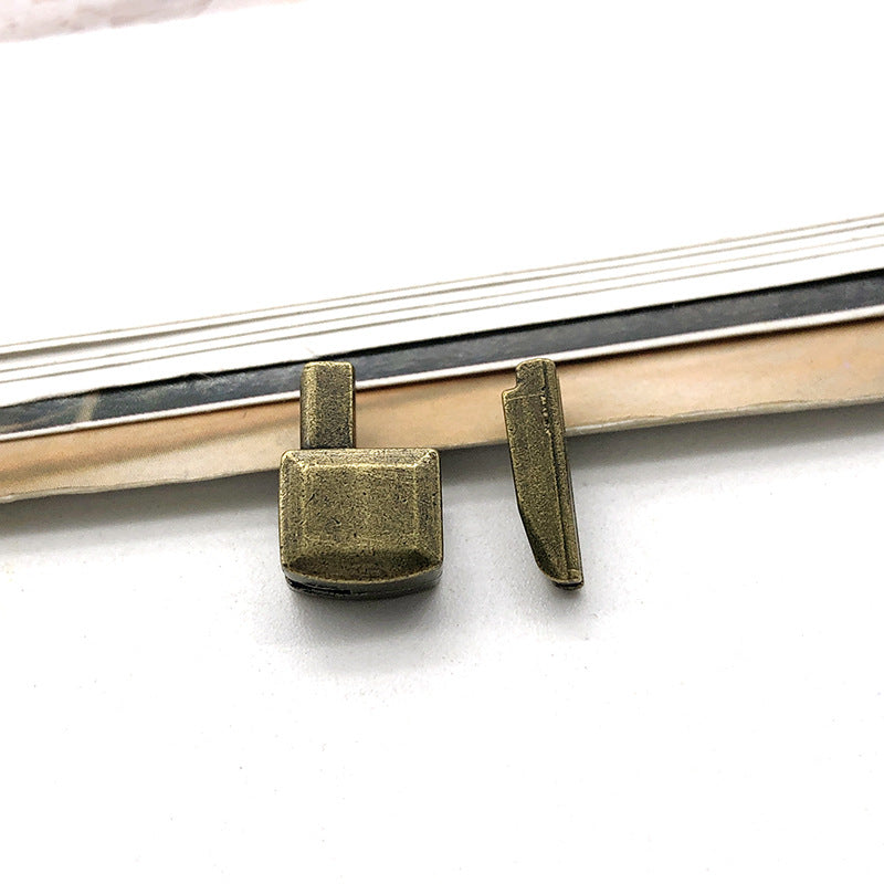 Dark-bronze #5 zipper slider retainers on zipper tape, metal replacement parts