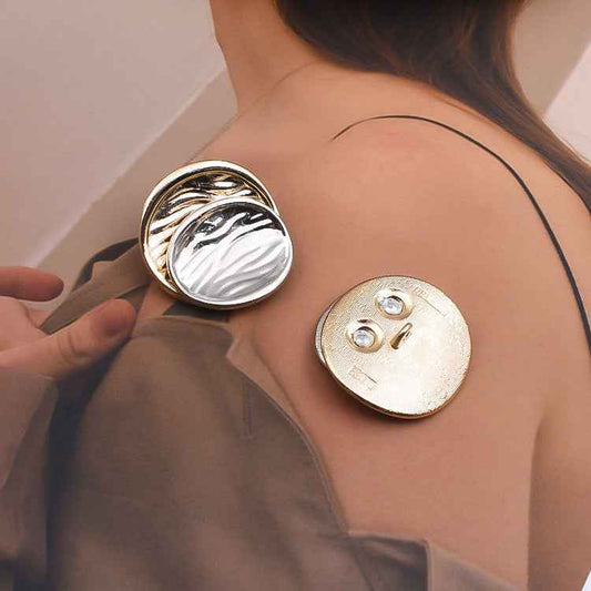 Pair of concave gold-and-silver metal shank buttons with two-hole backs