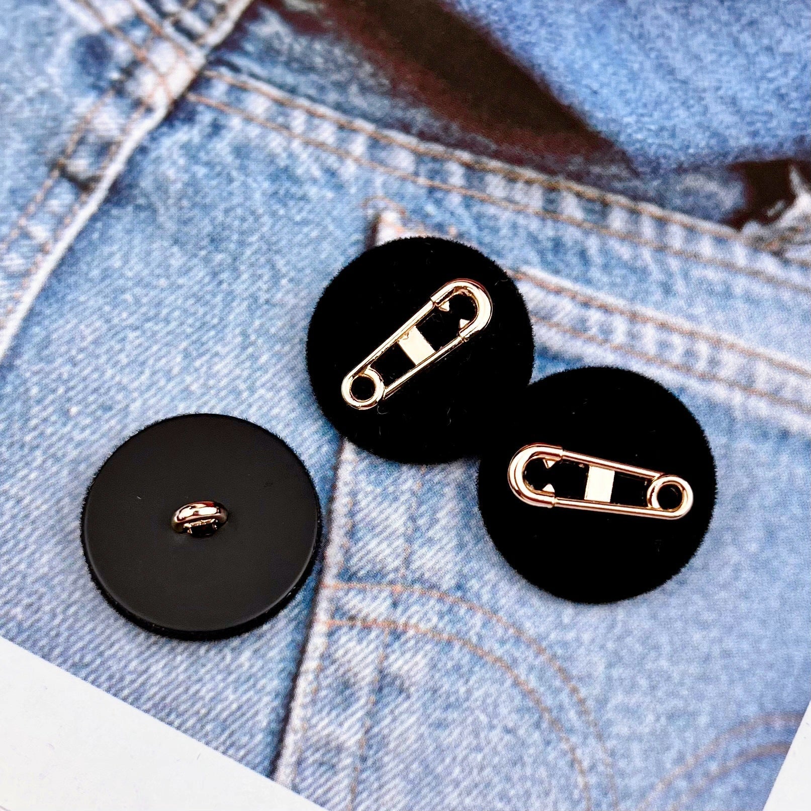 Black flocked pin buttons with metal backs: loop pin and safety-pin clasp