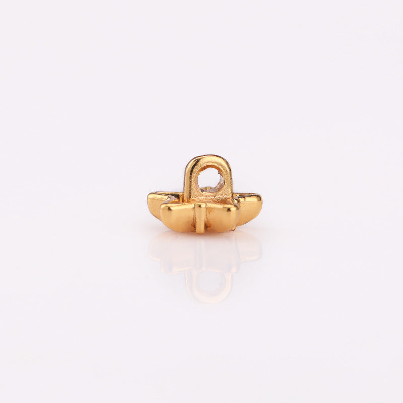 Gold-tone star metal shank button back view, visible loop and prongs