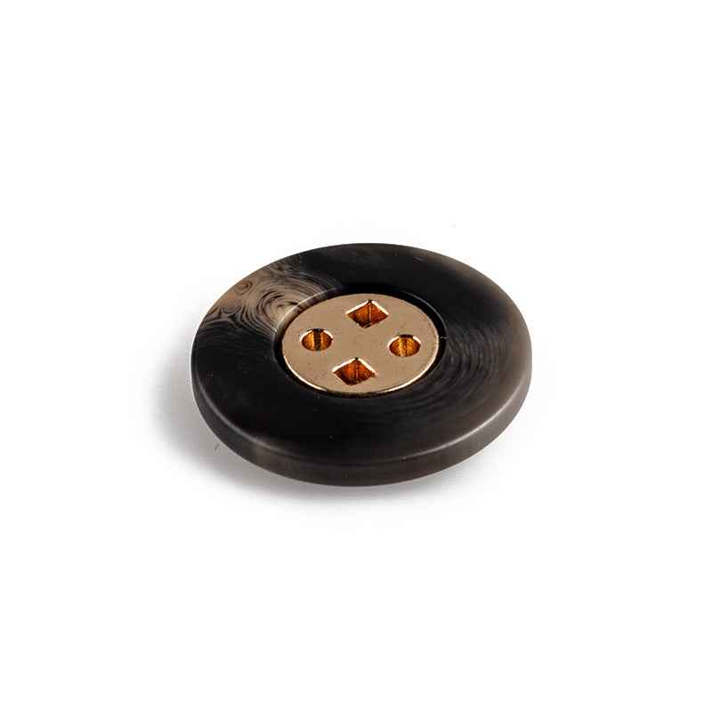 Black round resin button, four-hole metal plate visible from the side