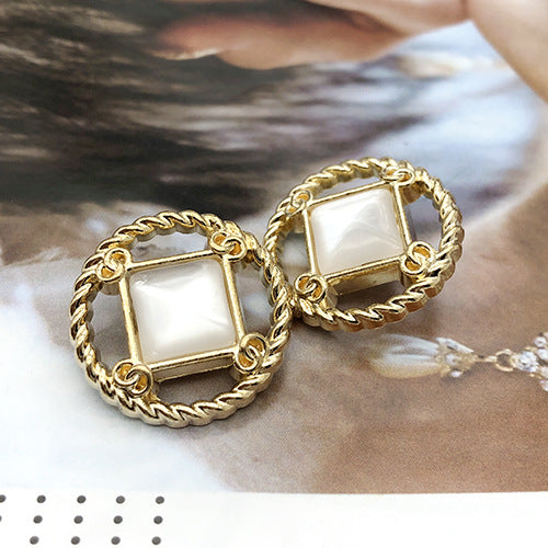 Style 5 round gold metal shank button, white square inset in ornate frame