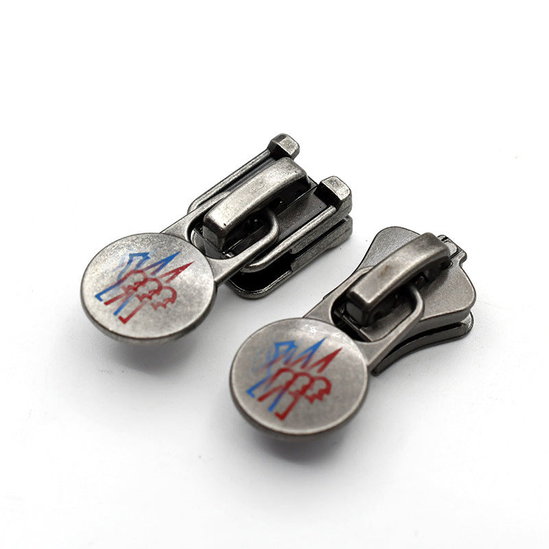 Jacket zipper pulls set—gunmetal/silver molded YKK Vislon #10, round pull tabs, 2 shown