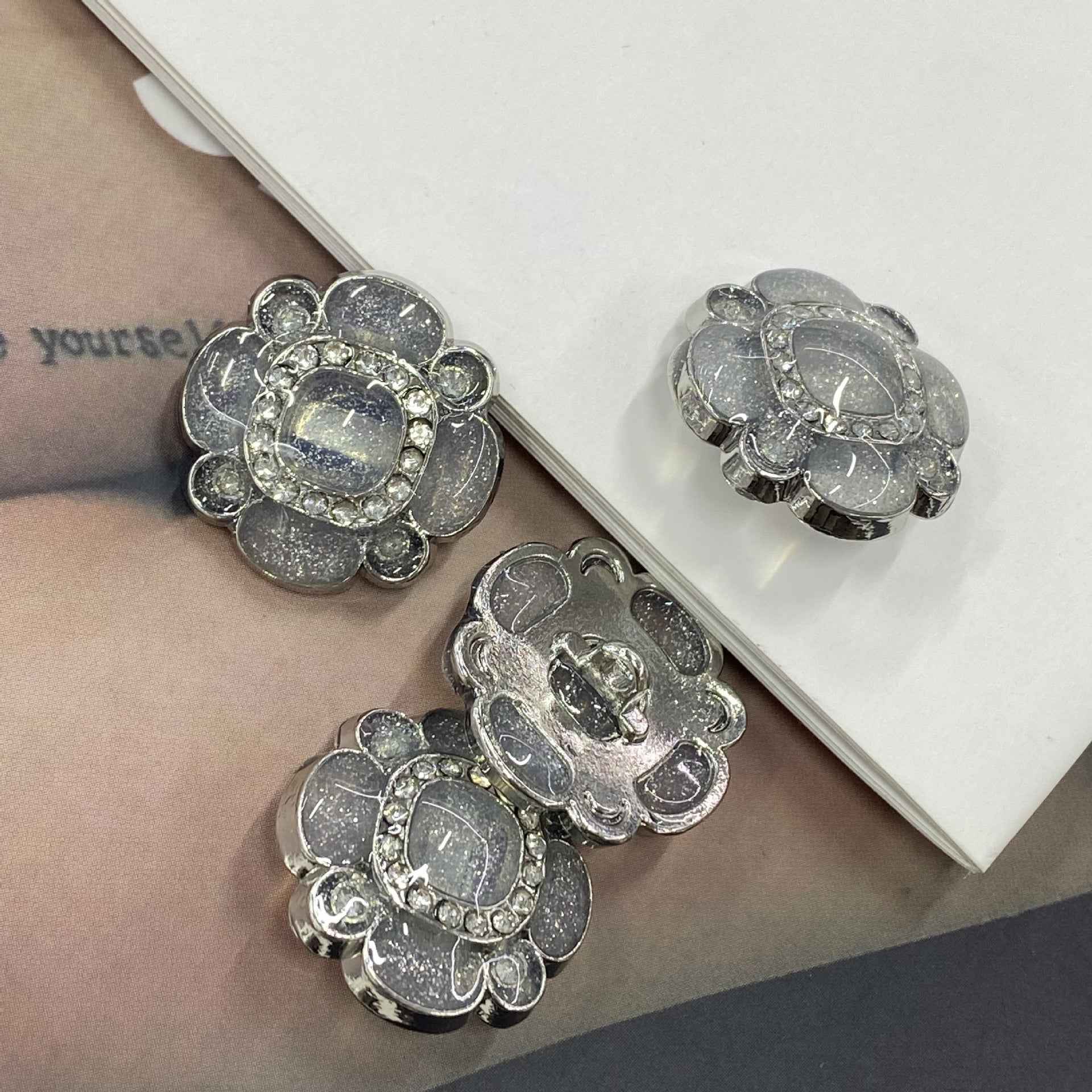 Glitter jelly flower metal shank buttons, silver-gray oval center with crystal border