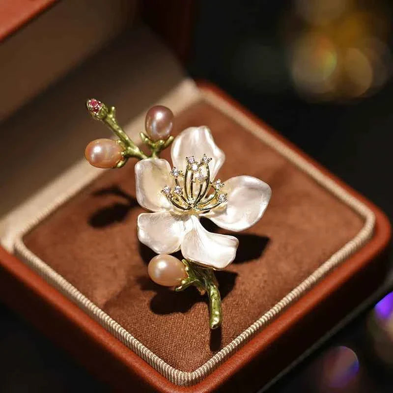 Centered peach blossom enamel brooch with white pearls, sparkling gold detail