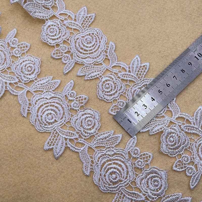 White floral lace trim border with roses; includes 6–9 cm scale