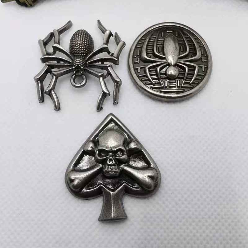 Silver spider claw rivet stud with round emblem and skull hands spade backplates