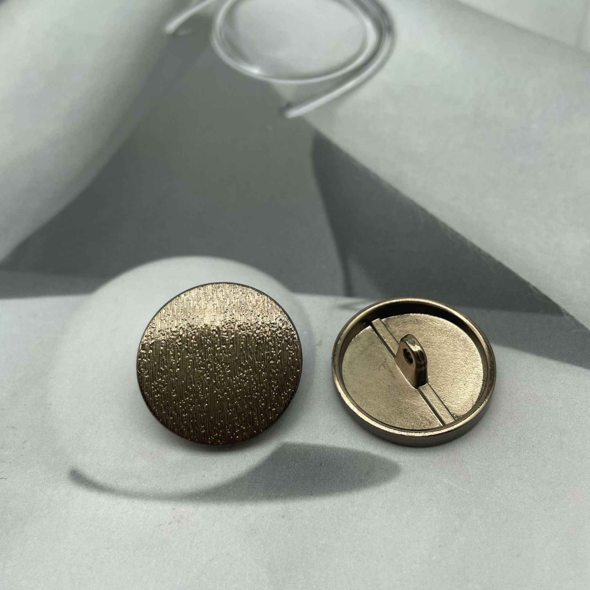 1-inch round matte metal shank button, tea gold front with shank back