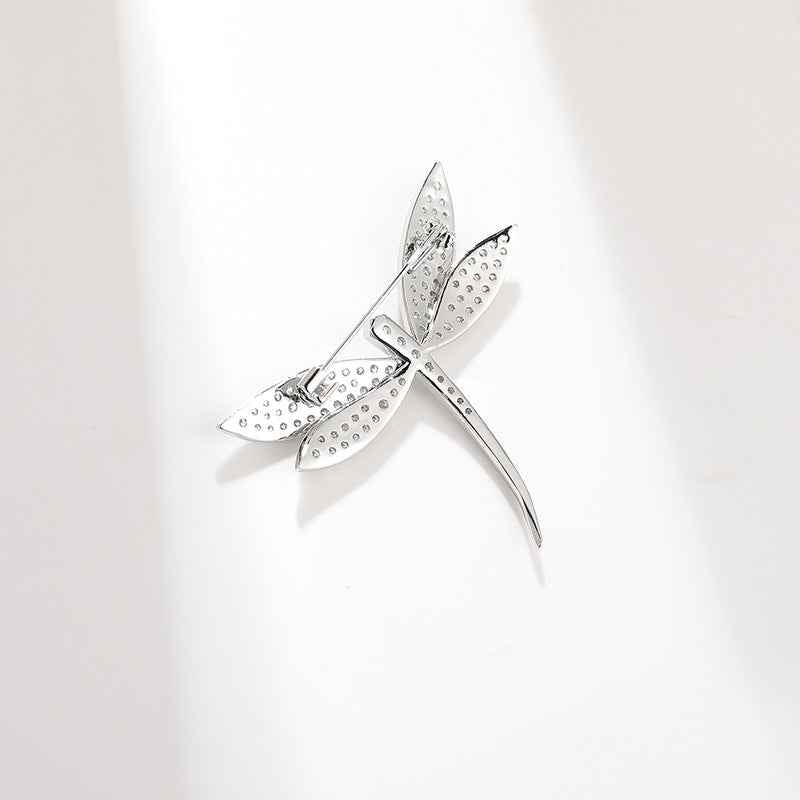 Silver-tone dragonfly brooch with studded wings and long pin back