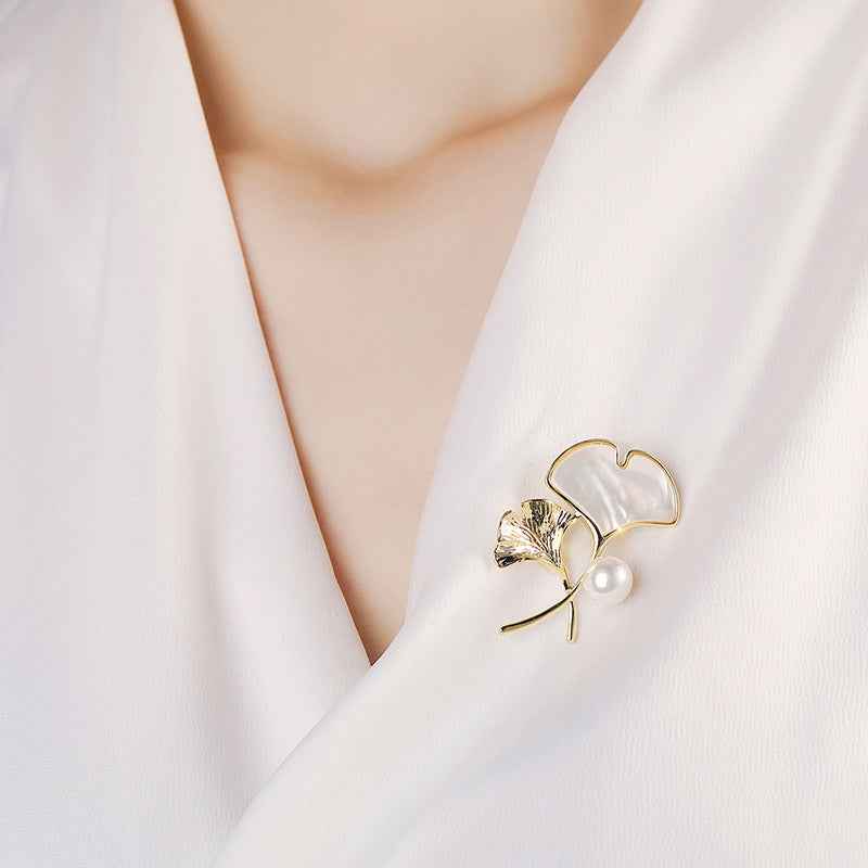 Gold-tone ginkgo leaf brooch pin with mother-of-pearl leaf and freshwater pearl