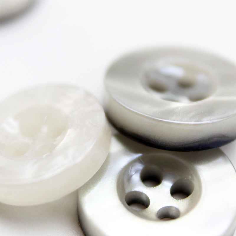 Wide-edge resin button, 4-hole front and underside; glitter transparent white