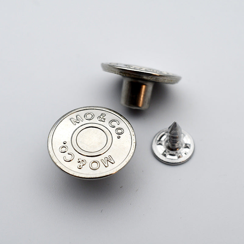 Round metal shank stud button with MO&Co logo on silver-toned face