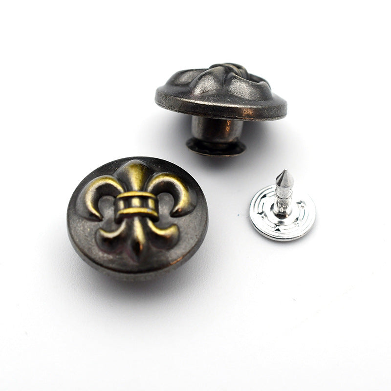 Round metal shank stud button with fleur-de-lis emblem, two-piece set