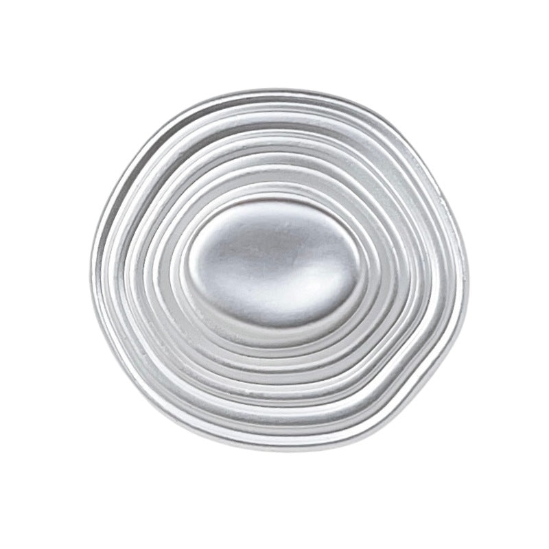 Silver hat-shaped metal button with concentric ridged rings and oval face