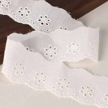 45/70mm cotton lace trim with embroidered eyelets, white